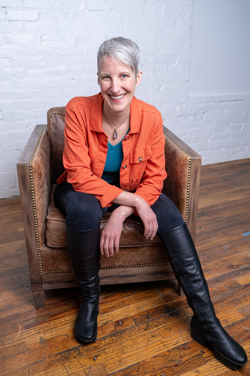 Kristen Peairs sitting in a chair and smiling